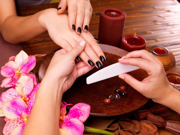 manicurist-master-makes-manicure-woman-s-hands-spa-treatment-concept